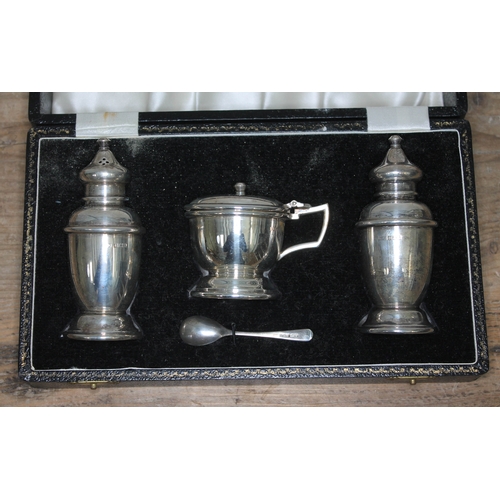 87 - A cased three piece hallmarked silver cruet.