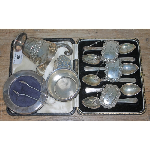 89 - A mixed lot of hallmarked silver comprising a cased set of Art Deco style teaspoons, three decanter ... 