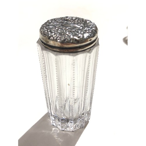 91 - A group of fourteen hallmarked silver topped or mounted glass bottles and jars, tallest 14cm.