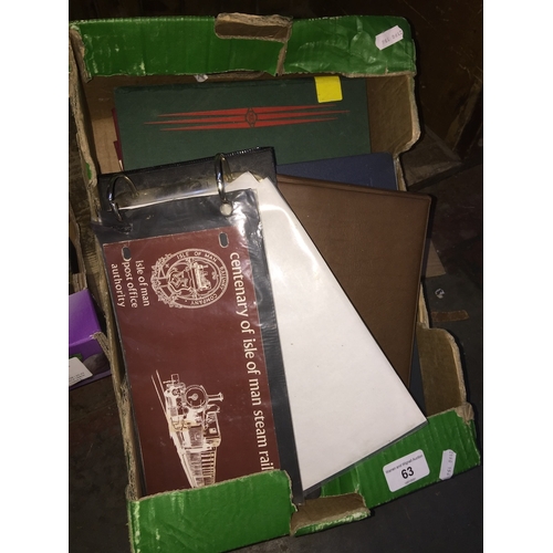 63 - A box of stamp albums and covers