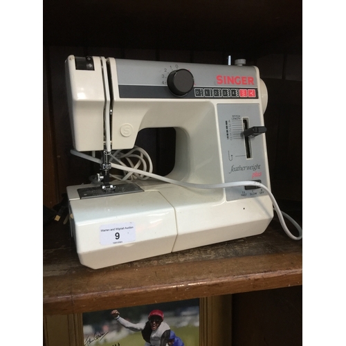 9 - A Singer featherweight plus sewing machine