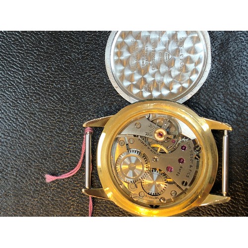 106 - A 1950s Tissot gold plated wristwatch having signed champagne dial with natural patina, gold tone ho... 