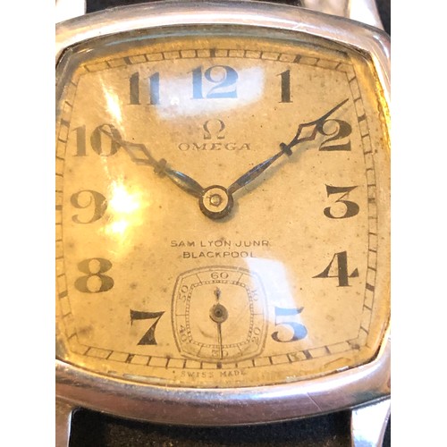 109 - A 1920s Omega wristwatch in hallmarked silver case having double signed dial for retailer Samuel Lyo... 