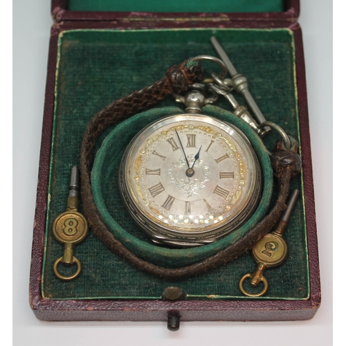 128 - A ladies silver pocket watch marked 0.900, in leather travel case, diam. 40mm, case 9cm x 8cm.