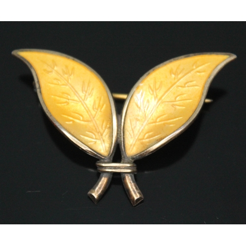 141 - A Norwegian silver and yellow enamel leaf brooch designed by Willy Winnaess for David Andersen, leng... 