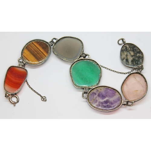 144 - A vintage mixed gemstone bracelet featuring irregular shaped cabochons of quartz varieties cat's eye... 