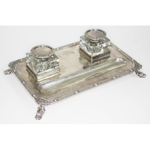 176 - A presentation silver inkstand, with two square glass inkwells on base with Celtic border and four m... 