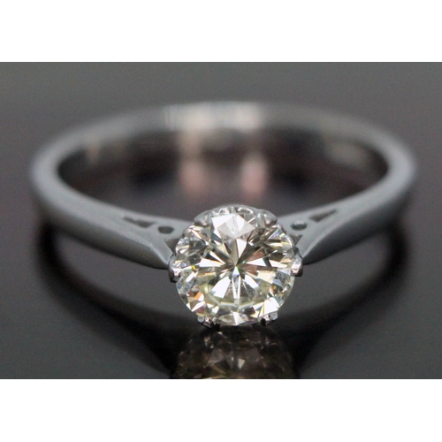 178 - A diamond solitaire ring, the round brilliant cut stone weighing approx. 0.67 carats (estimated) in ... 