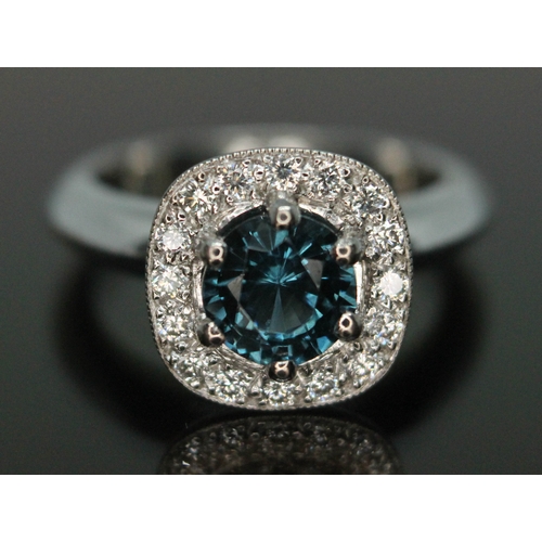 193 - A sapphire and diamond ring, the central round brilliant deep blue sapphire weighing approx. 1.38ct,... 