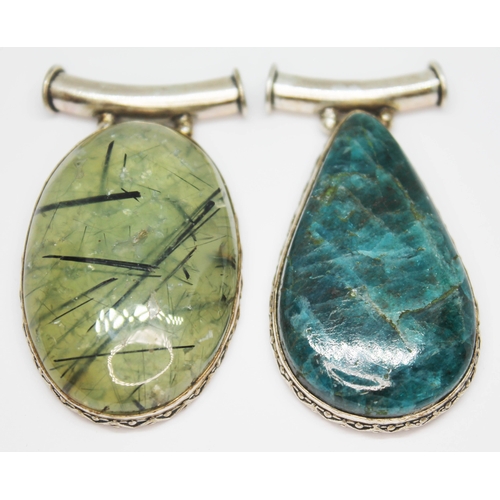 198 - Two eastern pendants, one set with a tourmaline included quartz cabochon and the other a pear shaped... 