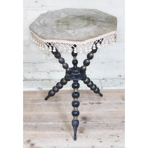 59 - A Victorian parcel gilt and ebonised Gypsy style table, height 66cm.