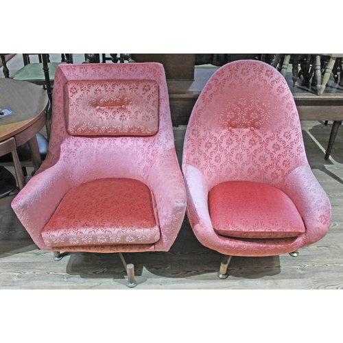 65 - A pair of retro egg chairs, each with four point teak swivel base.