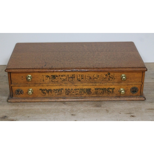 69 - An early 20th century oak advertisement bobbin drawers painted DEWHURST'S 