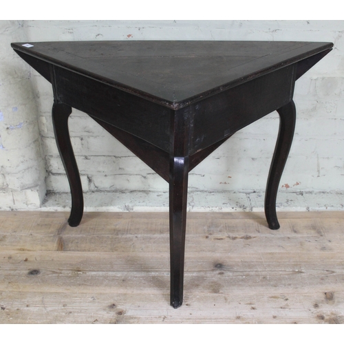 73 - An early 18th century oak gate leg table of triangular form with single drop leaf forming a square, ... 