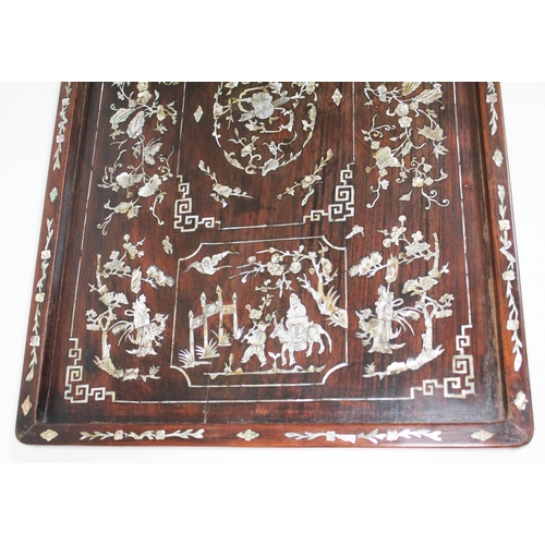 87 - A Chinese 19th century mother of pearl inlaid rosewood tray of rectangular form inlaid with figures,... 