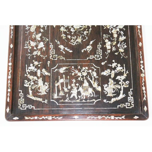 87 - A Chinese 19th century mother of pearl inlaid rosewood tray of rectangular form inlaid with figures,... 