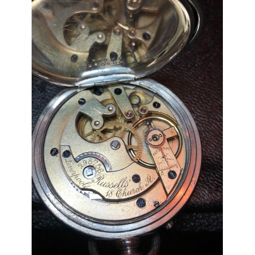 115 - A silver Zenith pocket watch marked .925 for repair together with a nickel plated Russells of Liverp... 