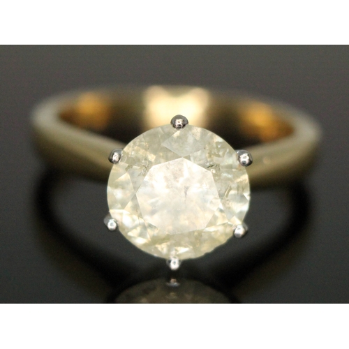 203 - A diamond solitaire ring, the stone weighing approx. 2.46ct, hallmarked 18ct gold band, gross wt. 4.... 