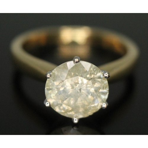 203 - A diamond solitaire ring, the stone weighing approx. 2.46ct, hallmarked 18ct gold band, gross wt. 4.... 