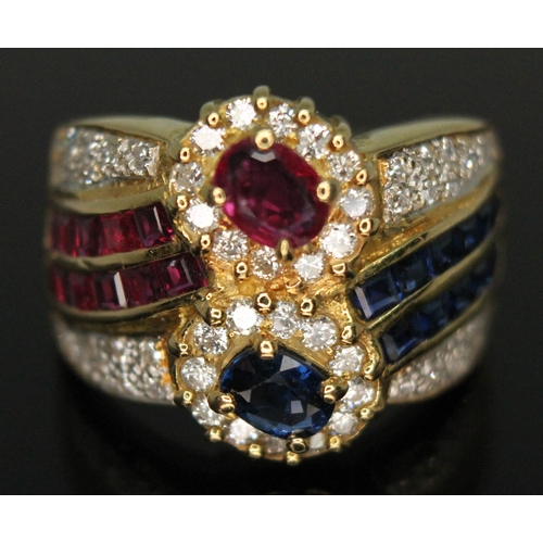 207 - A diamond, ruby and sapphire cluster ring, marked '14k', gross wt. 7.70g, size M.