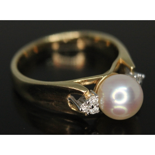 208 - A cultured pearl and diamond ring, marked '14K' and '585', gross wt. 4.15g, size N/O.