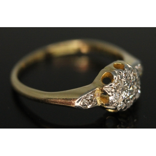 209 - An Edwardian diamond cluster ring, the central old European cut stone weighing approx. 0.12ct, band ... 