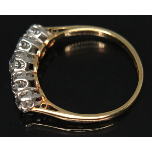 210 - An early 20th century five stone diamond ring, the central old European cut stone weighing approx. 0... 