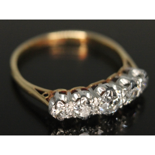 210 - An early 20th century five stone diamond ring, the central old European cut stone weighing approx. 0... 