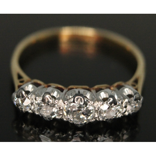 210 - An early 20th century five stone diamond ring, the central old European cut stone weighing approx. 0... 