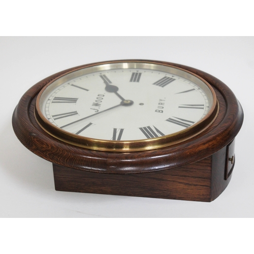 28 - A late Victorian oak cased wall clock, the 14