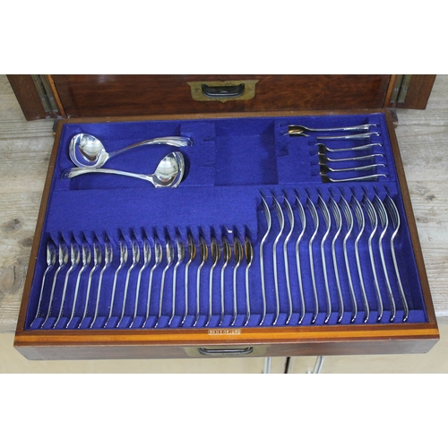 231 - An oak canteen containing a 12 place setting of silver plated cutlery with ivory handled knives, cam... 