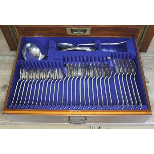 231 - An oak canteen containing a 12 place setting of silver plated cutlery with ivory handled knives, cam... 