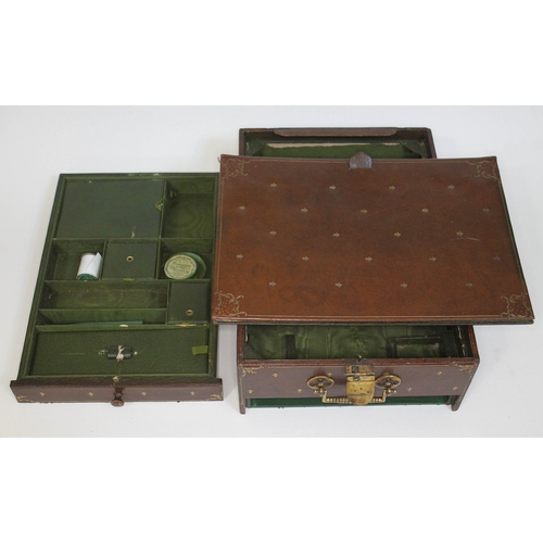 238 - A tooled leather travel writing box with note pad and lower drawer, brass lock and handle, J.C. Vick... 