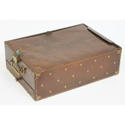 238 - A tooled leather travel writing box with note pad and lower drawer, brass lock and handle, J.C. Vick... 