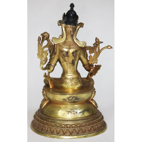 240 - A Tibetan gilt bronze buddha, height 21cm. UK P&P £20+VAT