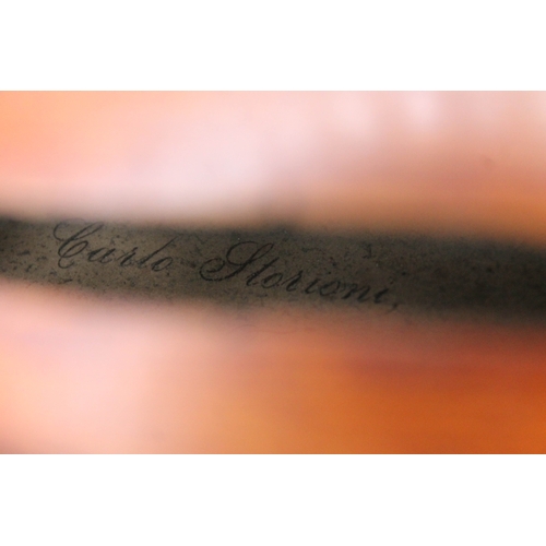 253 - A 19th century violin by Carlo Storioni, length of back 356mm, interior label dated 1890, with woode... 