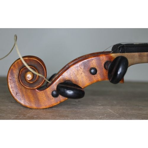 253 - A 19th century violin by Carlo Storioni, length of back 356mm, interior label dated 1890, with woode... 