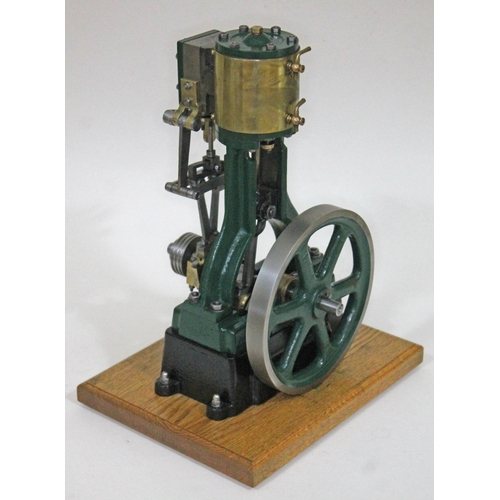 255 - A Stuart Turner model 5A live steam vertical engine, on mounted on wooden board, height 38cm.