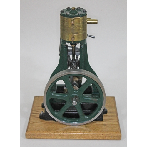 255 - A Stuart Turner model 5A live steam vertical engine, on mounted on wooden board, height 38cm.