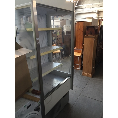 962 - A large shop display fridge