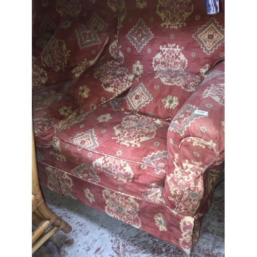 1008 - A crimson patterned two seater sofa