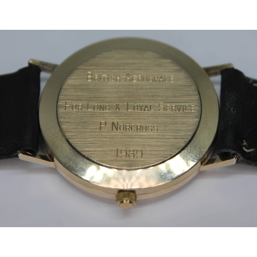 107 - A 9ct gold 1980s British Aerospace presentation quartz wristwatch having signed champagne dial, gold... 