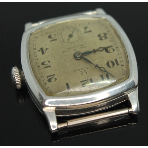 109 - A 1920s Omega wristwatch in hallmarked silver case having double signed dial for retailer Samuel Lyo... 