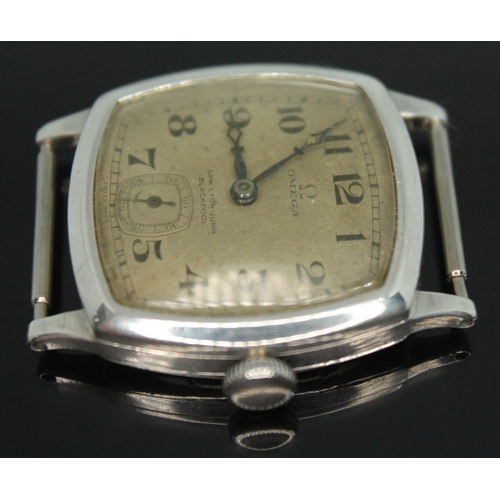 109 - A 1920s Omega wristwatch in hallmarked silver case having double signed dial for retailer Samuel Lyo... 