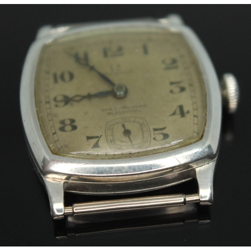 109 - A 1920s Omega wristwatch in hallmarked silver case having double signed dial for retailer Samuel Lyo... 