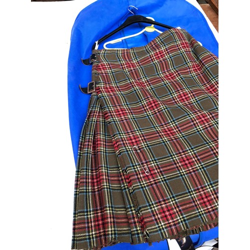 113 - Two tartan kilts and one pair of tartan trousers.