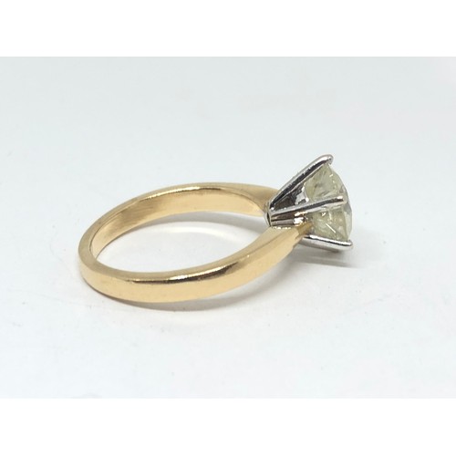 203 - A diamond solitaire ring, the stone weighing approx. 2.46ct, hallmarked 18ct gold band, gross wt. 4.... 