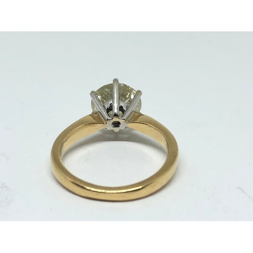 203 - A diamond solitaire ring, the stone weighing approx. 2.46ct, hallmarked 18ct gold band, gross wt. 4.... 