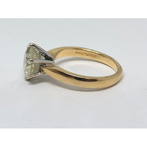 203 - A diamond solitaire ring, the stone weighing approx. 2.46ct, hallmarked 18ct gold band, gross wt. 4.... 