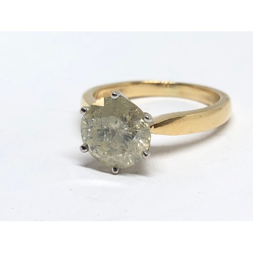 203 - A diamond solitaire ring, the stone weighing approx. 2.46ct, hallmarked 18ct gold band, gross wt. 4.... 